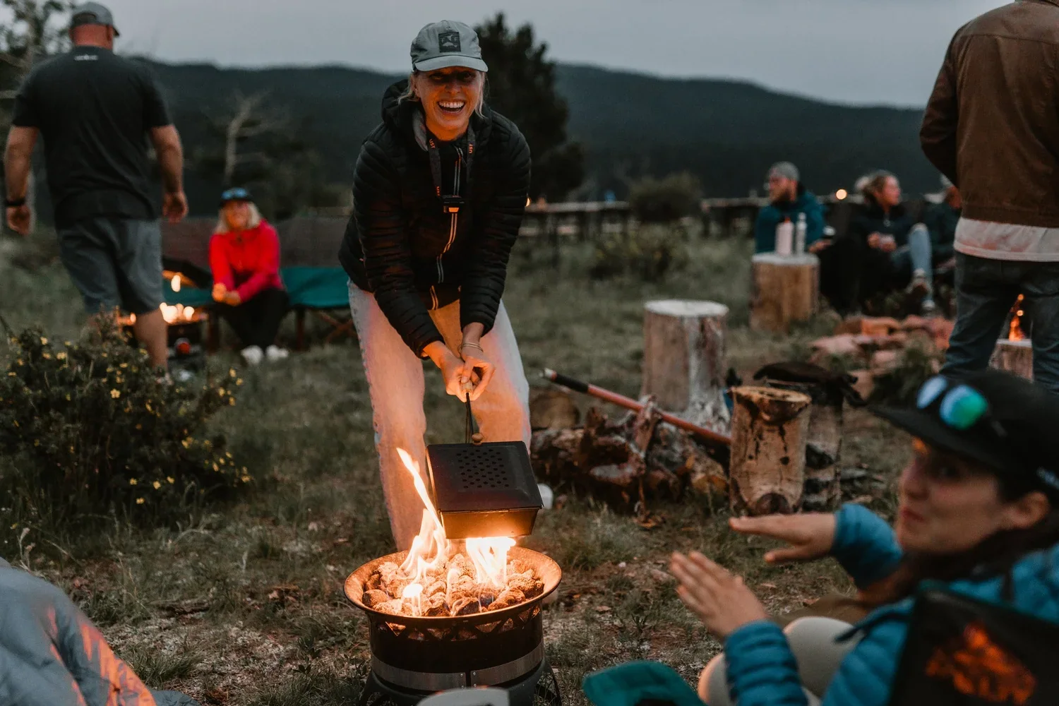 Friends enjoying a campfire on a Colorado mountain property