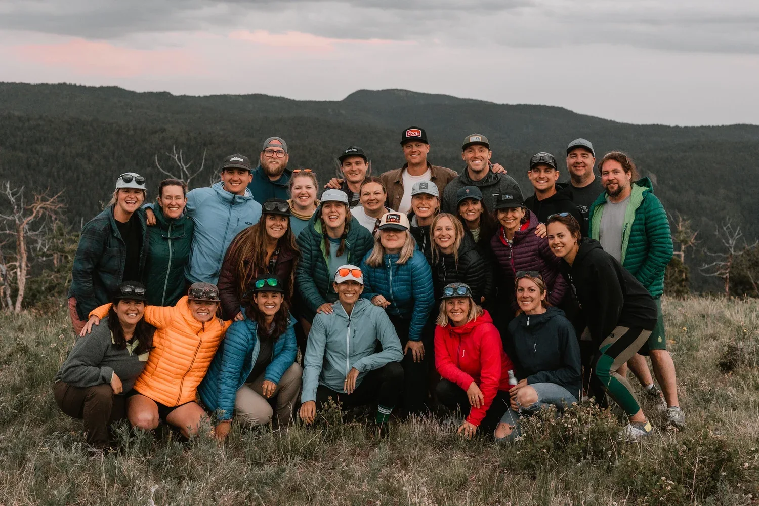 A group portrait from a gathering on private mountain land